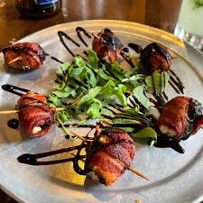 Raleigh Times Bar signature dishes Salmon Fried Rice
Fried Buffalo Chicken
Devils on Horseback